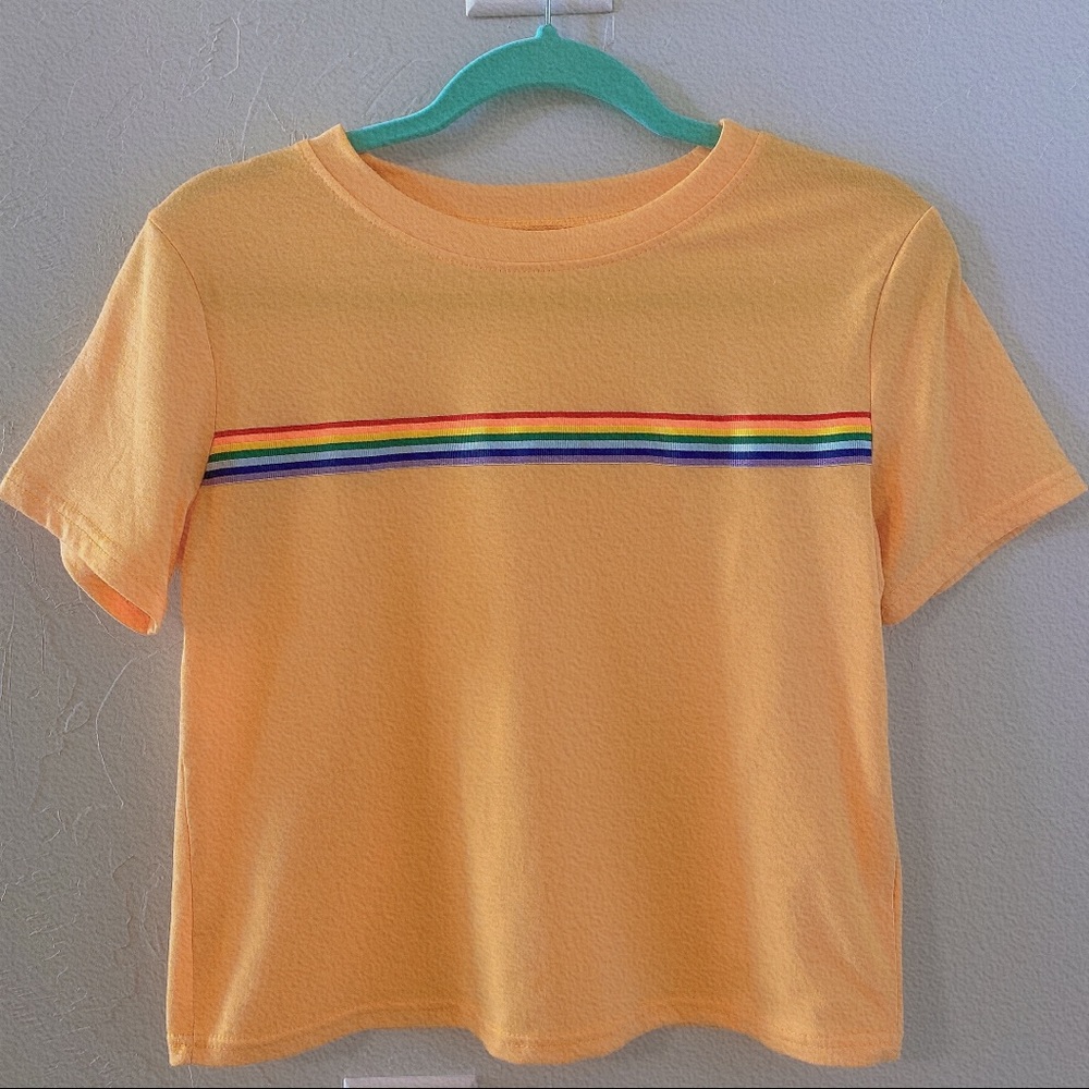 Yellow crop top with rainbow stripes.